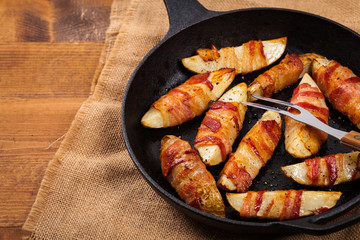 Bacon Wrapped Potatoes Wedges. Selective focus.