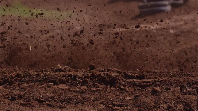 Motocross racer makes dirt fly in slow motion 