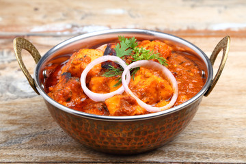 Indian Food or Indian Curry in a copper brass serving bowl.