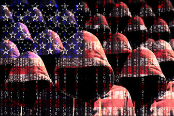 Group of hooded hackers shining through a digital american flag