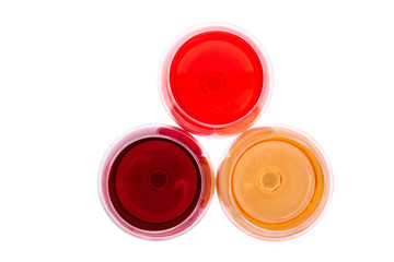 Red, white and rose wine glasses up on white isolated. Top view..