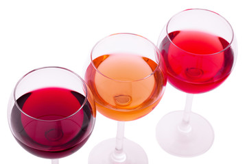 Red, white and rose wine glasses up on white isolated. Top view..