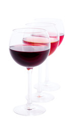 Red, white and rose wine glasses up on white isolated