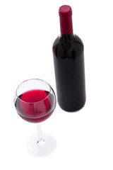 Red Wine bottle and glass on white background. Unusually top view.