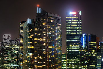 Amazing glowing windows of skyscrapers. Night cityscape