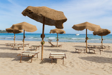 Parasols on a beach in the afternoon
