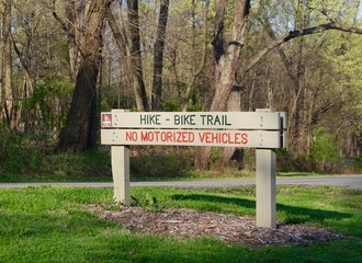 The park trail sign on a close up view.