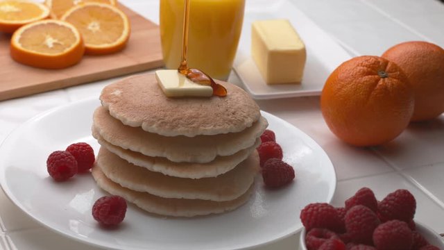 Syrup pouring onto stack of pancakes in super slow motion, shot on Phantom Flex 