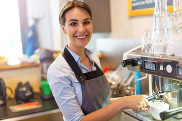 Woman working in coffee shop
