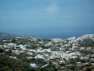 Fototapeta premium Steep slopes of Santorini/Beautiful resort among the Cyclades in the Aegean sea, Greece. Typical white and blue architecture