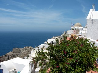 On Santorini island. Beautiful resort among the Cyclades in the Aegean sea, Greece. Typical white and blue architecture. And fresh spring greens