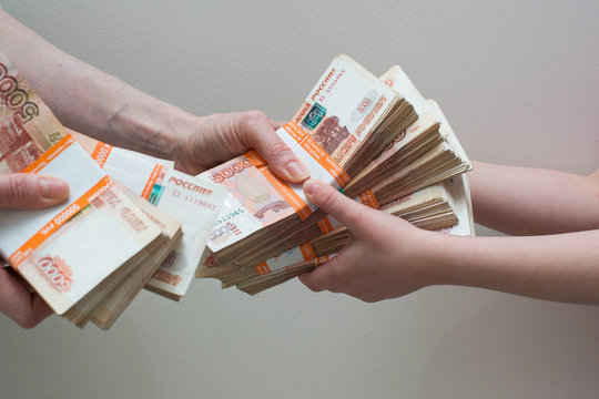 hand with stack of Russian money