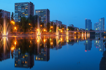 Obraz premium Colorful fountains and city lights