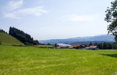 Fototapeta na wymiar Allgau panorama, mountains and green meadows