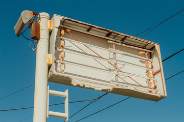 Sign of a broken and abandoned trade against blue sky