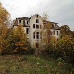 Ruined sanatorium, long abandoned and overgrown by nature - obrazy, fototapety, plakaty