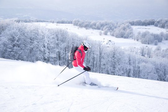 Woman skiing in mountain ski resort