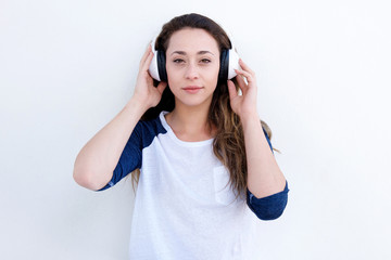 beautiful young woman listening to music with headphones