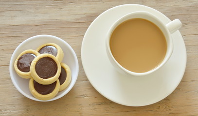 butter cookies topping chocolate cream and coffee cup