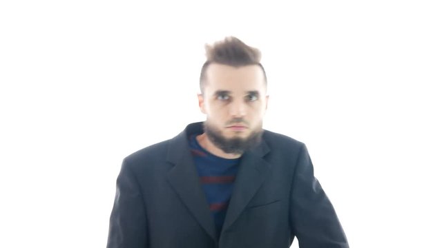 Funny bearded man in suit dancing and staring at you, studio isolated on white background.