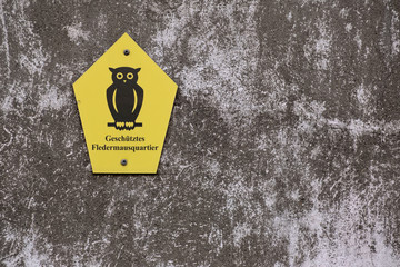 Official German owl marking a nature protection area. The text means Protected bat home
