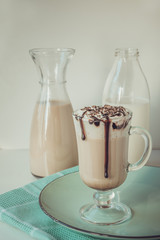 Hot coffee latte with thick foam and grated chocolate. Vintage toned.
