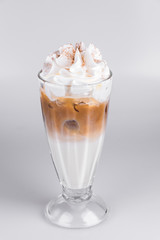 Latte with whipped cream on isolated white background