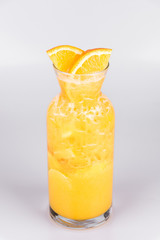 Orange lemonade carafe on isolated white background