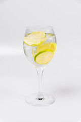 Water with lemon on isolated white background