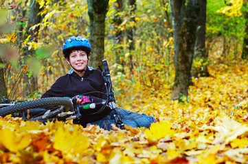 Cyclist wearing a helmet resting after cycling