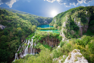 Fototapeta na wymiar Beautiful summer forest, lake and waterfall