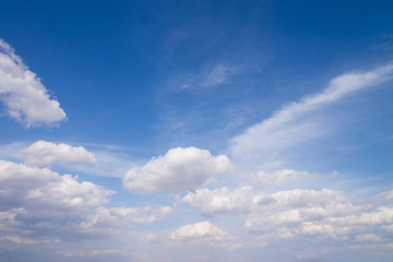 Blue sky with close up white fluffy tiny clouds background and p