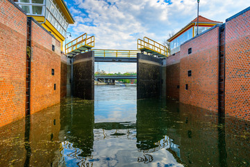 lock gates of the water dam in river - obrazy, fototapety, plakaty