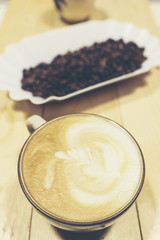 Drip coffee latte art, vintage filter image