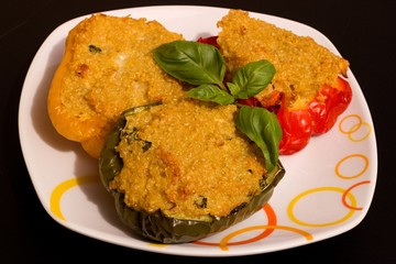Colorful peppers with couscous on a plate