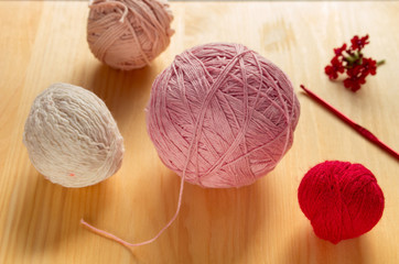 Yarns for knitting on a table.