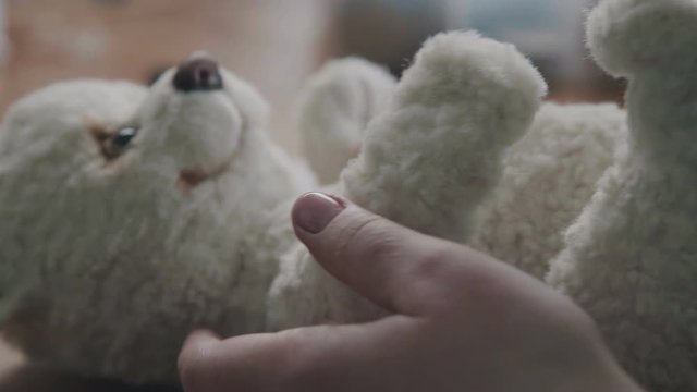 The process of creating a plush toy. The plush toy is made by hand. A hand-made teddy bear. Teddy Bear in vintage style is an old-fashioned toy of the 20th century. Soft toy for the collector.