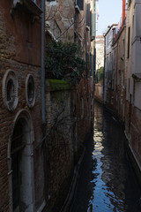 A small typical canal in Venice, Italy