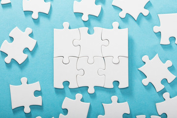 White Jigsaw Puzzles On Blue Background