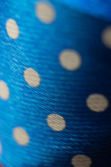 blue cloth with white polka dots
