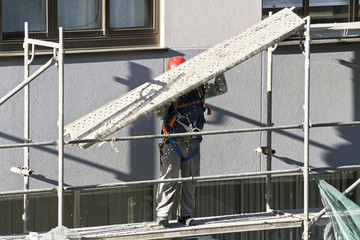 construction workers in  scaffolding in site