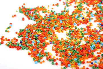 Colorful beads on white background. Abstract glass jewellery beads pattern.