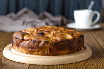 Apple vegan pie with coffee and snowdrops