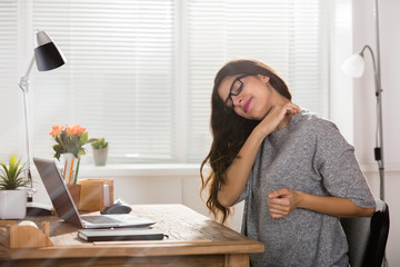 Businesswoman Having Neck Pain