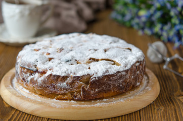Apple vegan pie with coffee and snowdrops