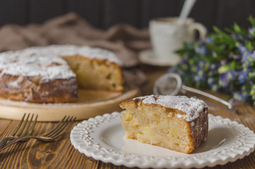 Apple vegan pie with coffee and snowdrops