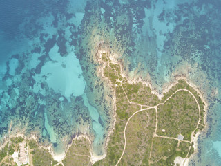 Fototapeta na wymiar Aerial view of the Sardinian Emerald Coast, with its turquoise sea. Costa Smeralda in Sardinia Island, is one of the most beautiful and famous coasts in the world