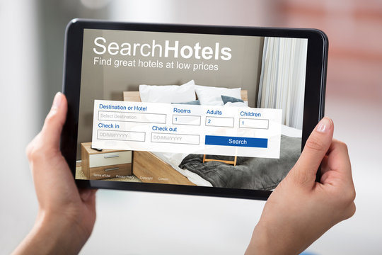 Woman Searching Online Low Priced Hotels