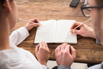 Couple Drawing On Check Note Book