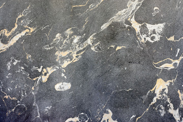 Background of black marble with interspersed